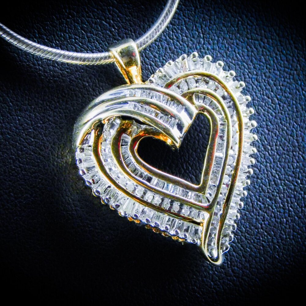 Diamond Heart Pendant with gold accents. Comes with Chain.